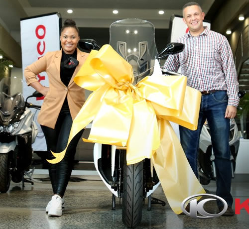 Zama Khumalo receives her Kymco scooter Idols SA prize from Yamaha