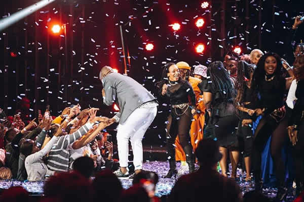 Idols SA Season 18 winner Thapelo Molomo performs his debut single “Phanda Phanda” while being congratulated by fans.